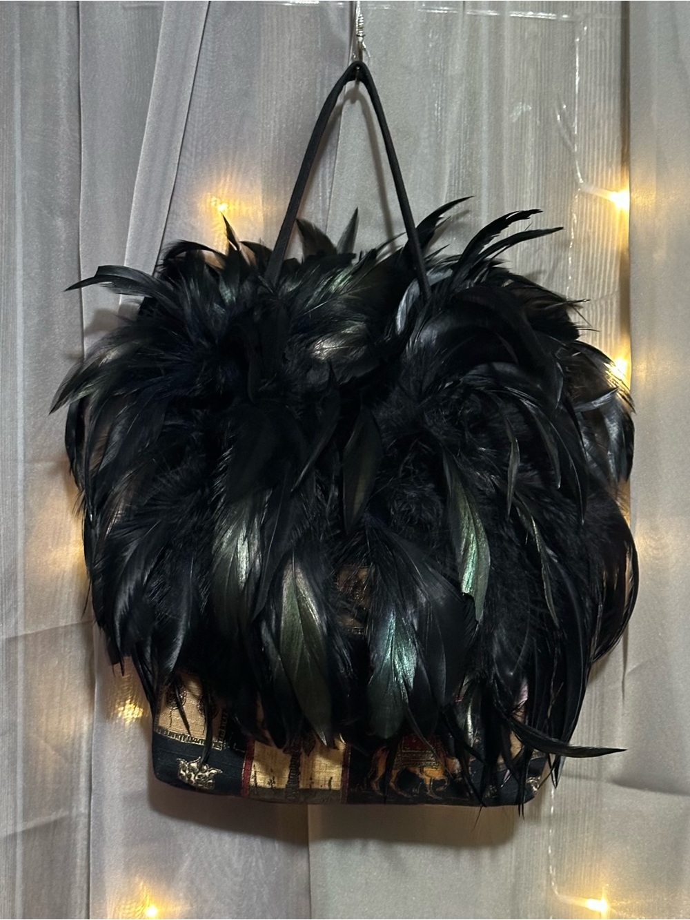 Black feathered Egyptian print camel and palm tree handbag